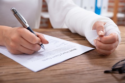 Man filling out workers comp papers